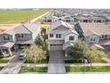 Aerial view of a home showing landscaping, driveway and surrounding neighborhood at 4381 E Rawhide St, Gilbert, AZ 85296