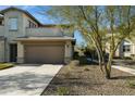 Charming two-story home featuring a neutral color palette, well-manicured landscaping, and a spacious two-car garage at 5100 E Rancho Paloma Dr # 2061, Cave Creek, AZ 85331