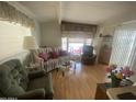 Cozy living room with laminate flooring, curtains and furniture at 1147 S Sioux Dr, Apache Junction, AZ 85119
