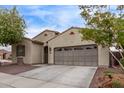 Charming single-story home with desert landscaping, private entry, and a two car garage at 16268 W Cortez St, Surprise, AZ 85379