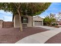 Single story home with desert landscaping, and a two-car garage at 16268 W Cortez St, Surprise, AZ 85379