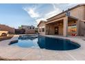 A beautiful inground pebble tec pool is the highlight of this relaxing home backyard at 1701 E Yukon Dr, Phoenix, AZ 85024