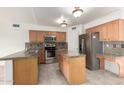 Well-equipped kitchen with stainless steel appliances and granite countertops at 1701 E Yukon Dr, Phoenix, AZ 85024