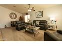 Inviting living room showcases comfortable seating, ceiling fan, and neutral-toned walls at 1844 E Angelica St, Casa Grande, AZ 85122