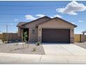 Lovely single-story home with a low-maintenance front yard and a convenient attached garage at 318 S San Fernando Ln, Casa Grande, AZ 85194