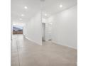 Bright, open-concept living area with neutral tile flooring and access to the backyard at 345 S Alegria Ln, Casa Grande, AZ 85194