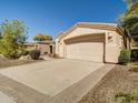 Single-story home with a two-car garage and low-maintenance desert landscaping at 3918 E Carson Rd, Phoenix, AZ 85042