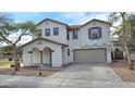 Beautiful home with a two car garage and a charming entrance with arched columns at 4908 N 110Th Dr, Phoenix, AZ 85037