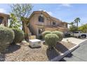 The exterior view showcases the home's architecture and well-kept landscaping and attached garages at 5450 E Mclellan Rd # 102, Mesa, AZ 85205
