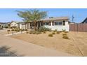 Inviting single-story home showcasing its well-manicured yard with desert landscaping and quaint exterior at 6926 E Culver St, Scottsdale, AZ 85257