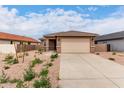 Inviting single-story home featuring a neutral color palette, low-maintenance landscaping, and a two-car garage at 7342 E Hackamore Ln, San Tan Valley, AZ 85143