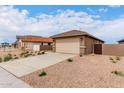 Charming single-story home featuring low-maintenance landscaping, a neutral color palette, and a two-car garage at 7342 E Hackamore Ln, San Tan Valley, AZ 85143