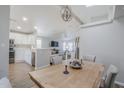 Open dining room with views of the kitchen, living area, and vaulted ceilings at 7373 E Us Highway 60 -- # 108, Gold Canyon, AZ 85118
