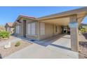 Exterior side view of home with covered carport at 7373 E Us Highway 60 -- # 108, Gold Canyon, AZ 85118