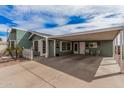 Charming single-story home with an attached carport and desert landscaping at 8500 E Southern Ave # 379, Mesa, AZ 85209
