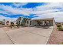 Charming single-story home with an attached carport and desert landscaping at 8500 E Southern Ave # 379, Mesa, AZ 85209