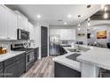 Beautiful kitchen featuring stainless steel appliances, grey cabinets and a contrasting white island countertop at 854 S Del Rio Ct, Apache Junction, AZ 85120