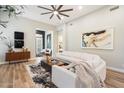 Comfortable living room with modern artwork, a ceiling fan, and lots of natural light at 9270 E Thompson Peak Pkwy # 381, Scottsdale, AZ 85255