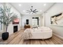 Cozy living room featuring a fireplace, wall-mounted TV, and access to the backyard at 9270 E Thompson Peak Pkwy # 381, Scottsdale, AZ 85255