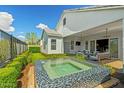 Beautiful backyard featuring a spa and landscaped yard at 11878 N Hershey St, Surprise, AZ 85388