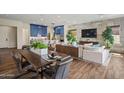 Open living space with a modern kitchen, dining area, and comfortable seating, perfect for entertaining at 11878 N Hershey St, Surprise, AZ 85388