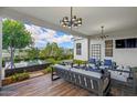 Inviting outdoor patio with comfortable seating, stylish lighting, and landscaped garden views at 11878 N Hershey St, Surprise, AZ 85388