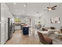 Spacious kitchen boasting an island with seating, granite countertops, and stainless steel appliances at 16155 E Glenview Pl, Fountain Hills, AZ 85268