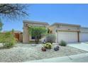 A charming home exterior with desert landscaping and a quaint, appealing design at 16857 E Deuce Ct, Fountain Hills, AZ 85268