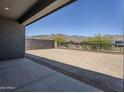 Spacious backyard with block wall and wrought iron fencing, ready for landscaping and outdoor enjoyment at 21450 W Meadowbrook Ave, Buckeye, AZ 85396