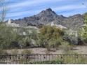 Picturesque view of mountains and homes in the community, as seen from the property at 3120 E Squaw Peak Cir, Phoenix, AZ 85016