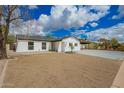 Attractive single-story home featuring desert landscaping and a covered carport at 4036 E Captain Dreyfus Ave, Phoenix, AZ 85032