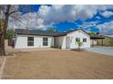 Quaint single-story home with desert landscaping, and a convenient carport at 4036 E Captain Dreyfus Ave, Phoenix, AZ 85032