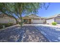 Lovely one-story home with xeriscaping, covered front porch, and attached garage at 4369 E Coal St, San Tan Valley, AZ 85143