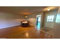 Open concept living room with wood floors and space for a dining table at 4773 E Hopi St, Phoenix, AZ 85044