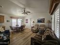 Inviting living room with lots of space, and a ceiling fan, perfect for relaxing or entertaining guests at 8700 E University Dr # 953, Mesa, AZ 85207