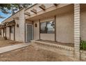 Exterior view of a single-story home with a sidewalk leading to the front door and a small garden area at 914 N Cherry --, Mesa, AZ 85201