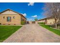 Long driveway and three-car garage add to the appeal of this beautiful single-story home at 17936 E Colt Ct, Queen Creek, AZ 85142