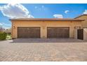 Spacious three-car garage offers ample parking and storage space with an inviting curb appeal at 17936 E Colt Ct, Queen Creek, AZ 85142