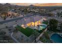 Aerial view showcasing the backyard pool, landscaped turf, and outdoor living space at 9826 N 131St St, Scottsdale, AZ 85259