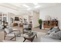 Spacious living area with open floor plan to kitchen, bar area, and natural light at 9826 N 131St St, Scottsdale, AZ 85259