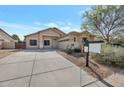 Inviting single-story home with desert landscaping and a well-maintained front yard at 11669 N 165Th Ave, Surprise, AZ 85388