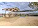 Large horse corral with sturdy metal fencing, offering ample space and safe enclosure for livestock at 25907 S 198Th St, Queen Creek, AZ 85142