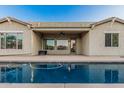 Beautiful backyard pool area with a covered patio and well-maintained water at 612 E Riviera Dr, Chandler, AZ 85249