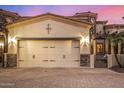 Two car garage with paneled doors on a brick paved driveway at 6202 E Mckellips Rd # 46, Mesa, AZ 85215