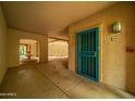 Building hallway with blue security door and community water feature at 14950 W Mountain View Blvd # 3105, Surprise, AZ 85374