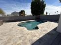 Backyard pool with built in bar seating and stone tile decking, great for entertaining friends and Gathering at 19045 N 45Th Ave, Glendale, AZ 85308