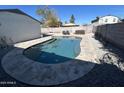 Backyard pool with lounge chairs and hot tub, perfect for relaxing on a hot day at 19045 N 45Th Ave, Glendale, AZ 85308