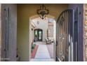 Welcoming courtyard with comfortable seating, lush landscaping, and a decorative chandelier at 30396 N 72Nd Pl, Scottsdale, AZ 85266