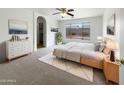 Bright main bedroom with large windows, soft carpet, and a walk-in closet at 4149 E Brighton Way, San Tan Valley, AZ 85140