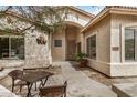 Inviting front entrance with covered seating area and decorative accents; perfect for enjoying the outdoors at 4518 E Aspen Way, Gilbert, AZ 85234